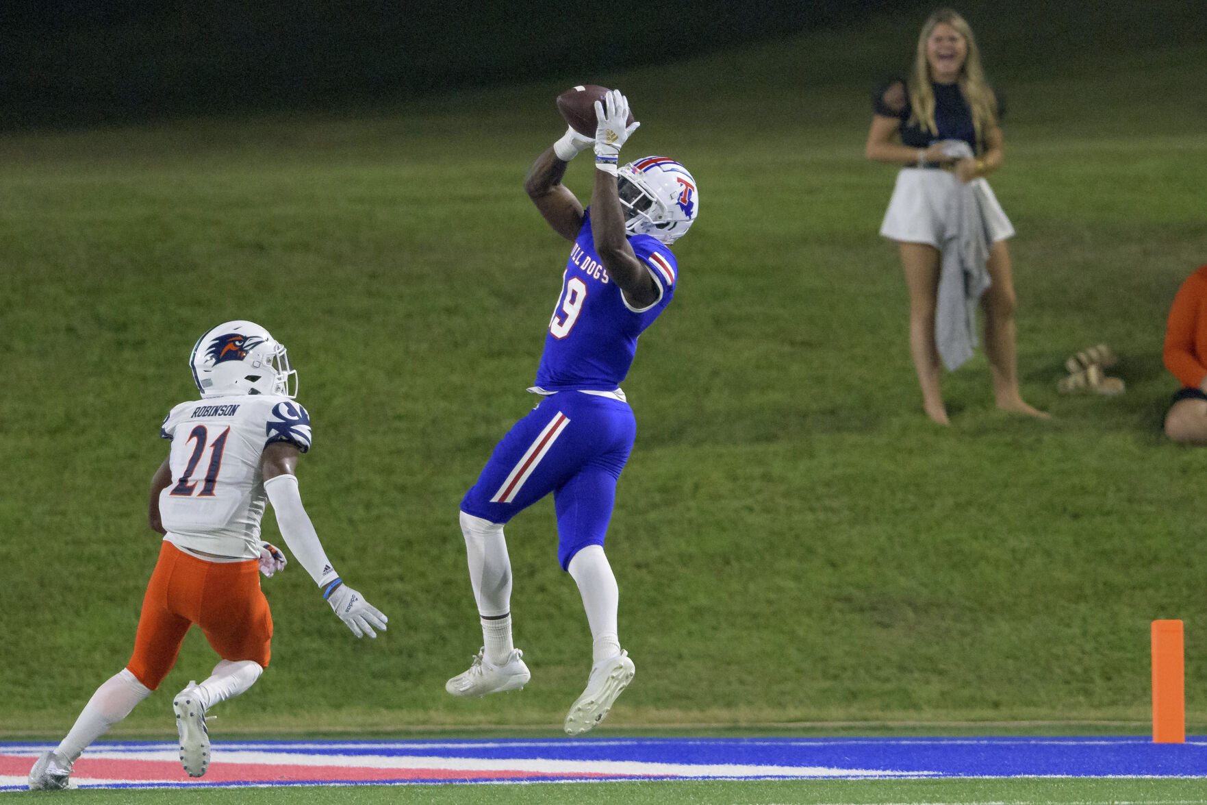 receiver catches a football